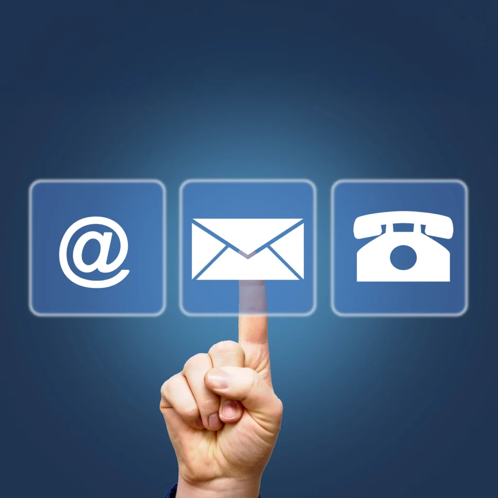 @, envelope and telephone icons floating on a blue field